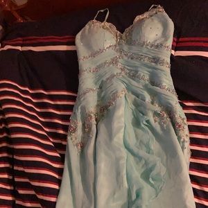 I am selling a brand new, light blue, sequin dress.